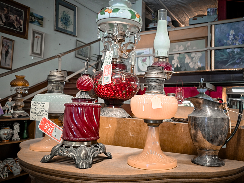 a set of antique oil lamps