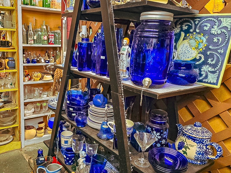 A cabinet of blue glassware