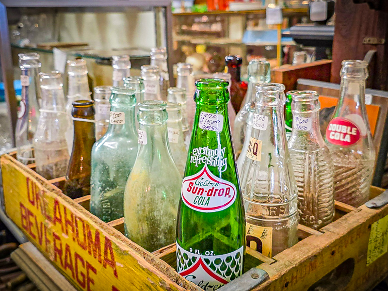 a crate of vintage soda bottles