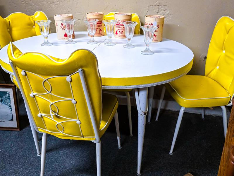 yellow and white kitchen table with chairs